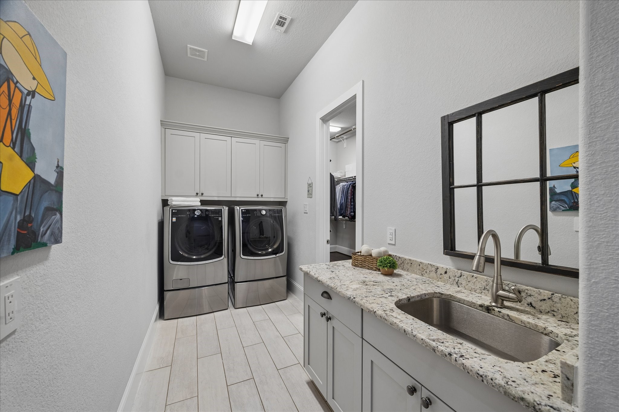 2223 Blue Duck Lane Conroe, TX 77384 - Photo 20 of 38 a bathroom with a sink and a mirror