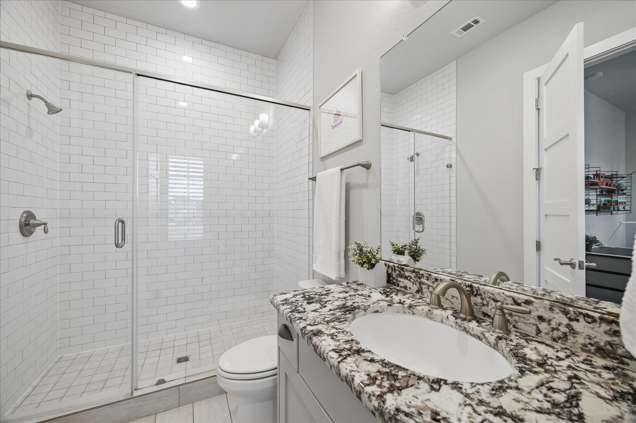 2223 Blue Duck Lane Conroe, TX 77384 - Photo 26 of 38 a bathroom with a granite countertop sink a toilet and shower