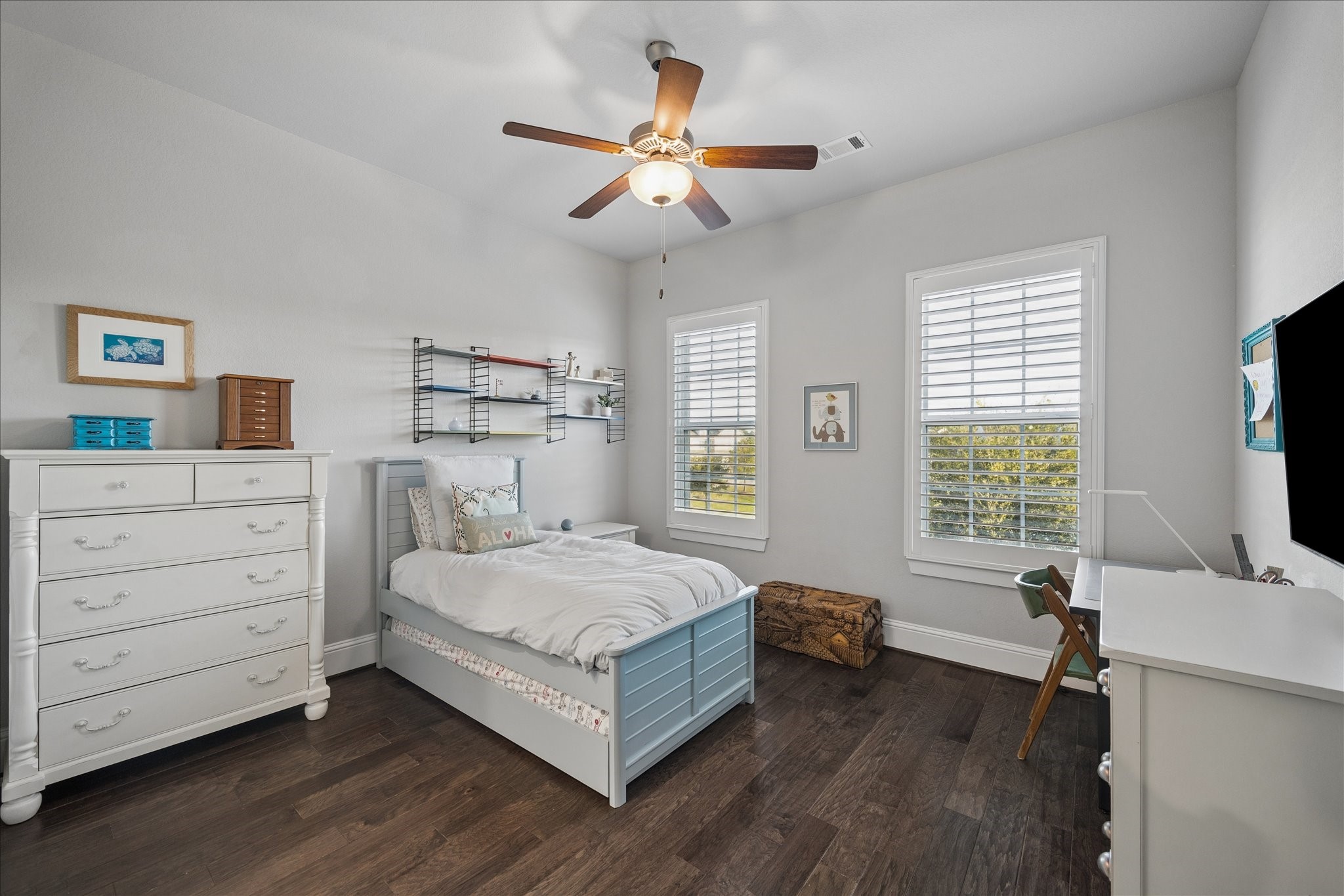 2223 Blue Duck Lane Conroe, TX 77384 - Photo 27 of 38 a bedroom with a bed and a flat screen tv