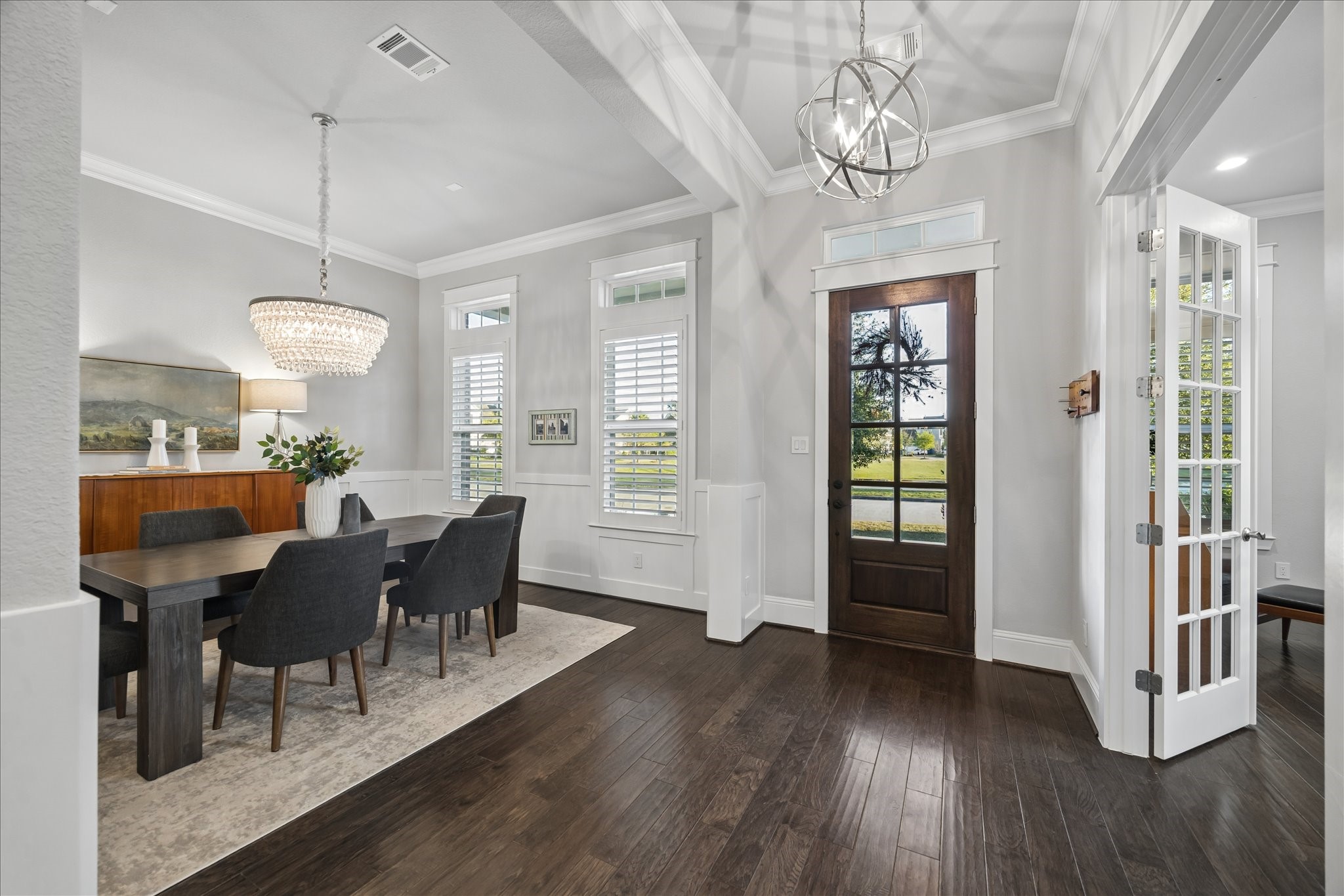 2223 Blue Duck Lane Conroe, TX 77384 - Photo 3 of 38 a view of a dining room with furniture window and wooden floor