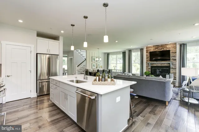 a kitchen with a sink stove and refrigerator