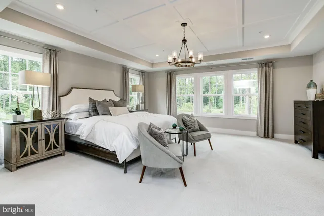 a bed room with a bed and a chair