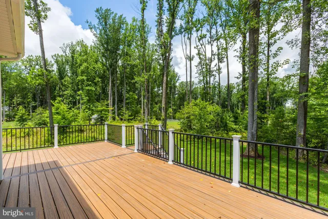a view of a balcony with wooden floor
