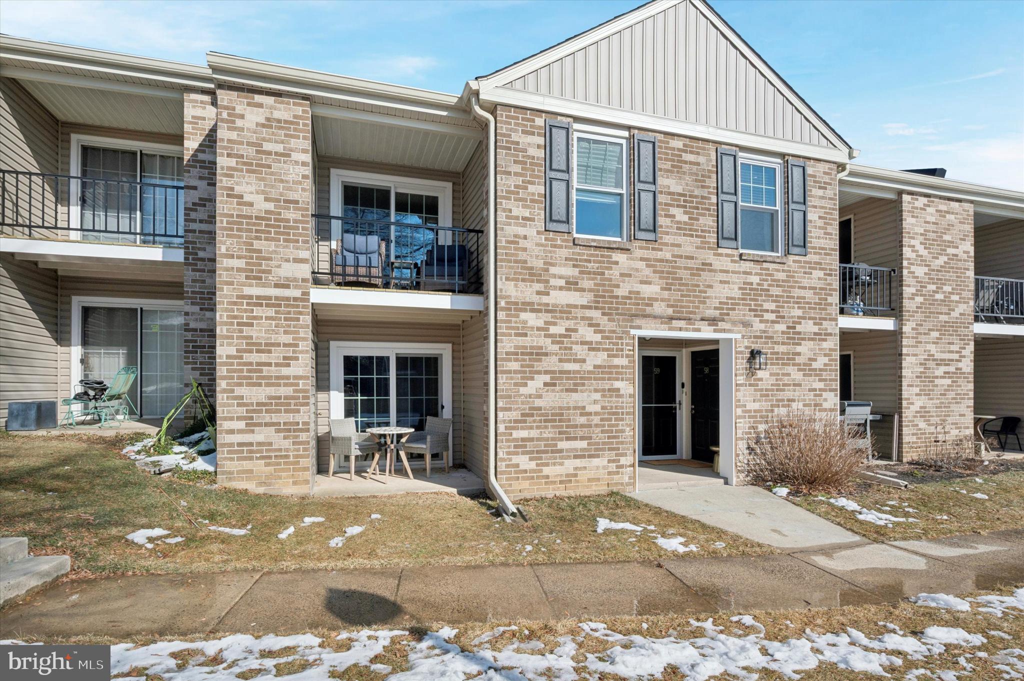 a front view of a house with yard