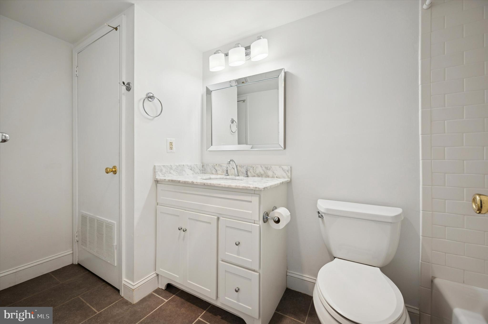 61 Ramsgate Court Blue Bell, PA 19422 - Photo 15 of 20 a bathroom with a toilet a sink a mirror and vanity