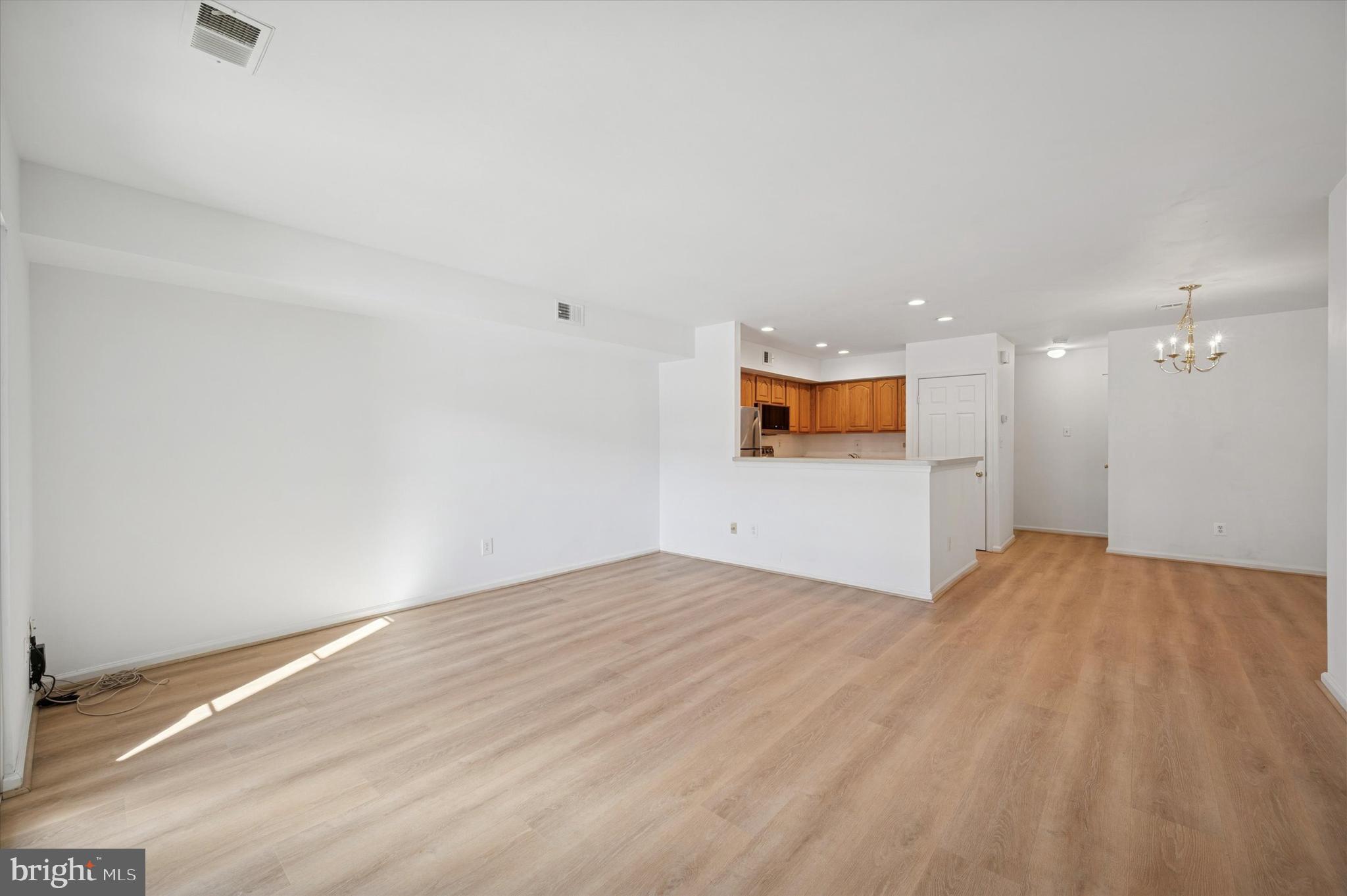 61 Ramsgate Court Blue Bell, PA 19422 - Photo 5 of 20 a view of empty room with wooden floor