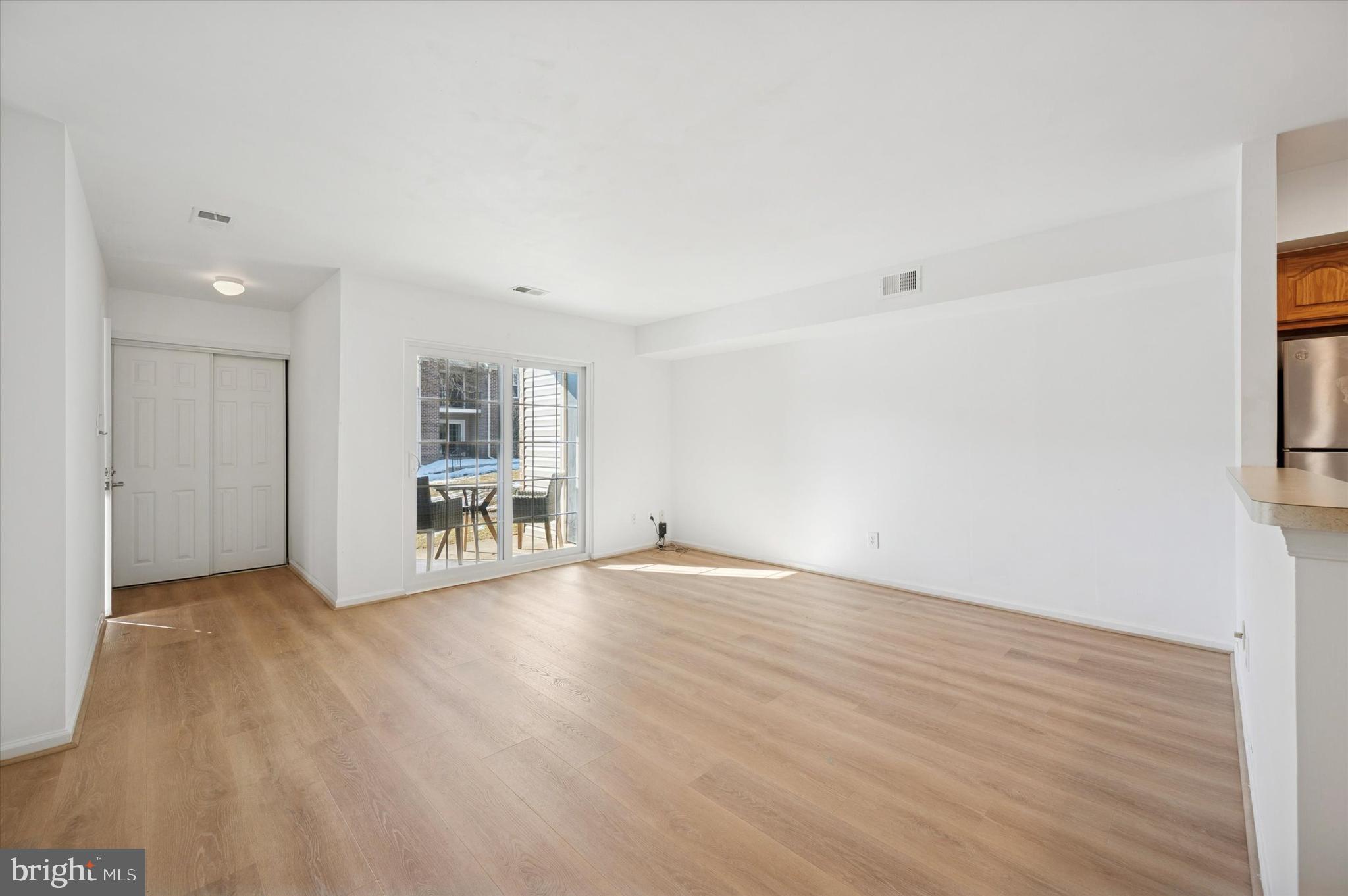 61 Ramsgate Court Blue Bell, PA 19422 - Photo 6 of 20 an empty room with wooden floor and windows