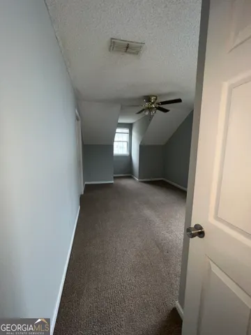 a bathroom with a shower and a sink