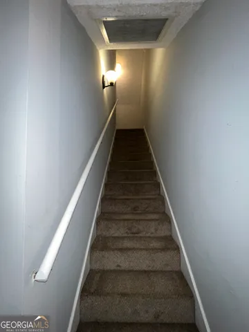 a view of a room with a staircase