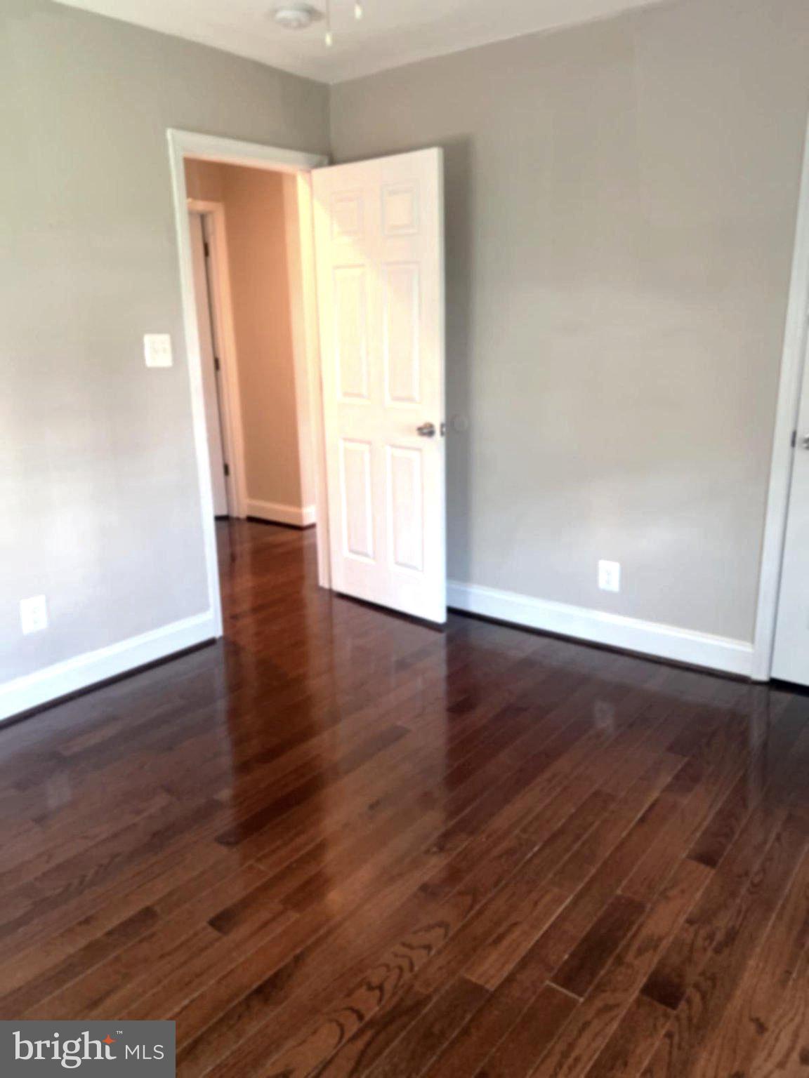 2006 Griffith Road Falls Church, VA 22043 - Photo 9 of 17 an empty room with wooden floor and windows