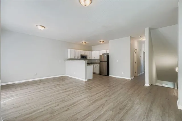 a view of kitchen with wooden floor