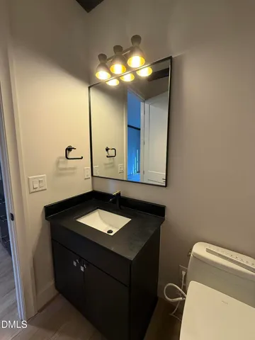 a view of walk in closet with clothes