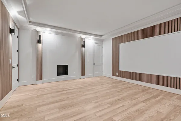 a kitchen with white cabinets and appliances