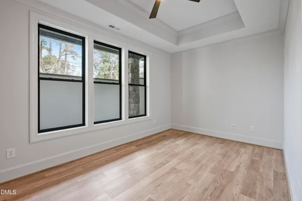 a kitchen with stainless steel appliances granite countertop a stove and a white cabinets