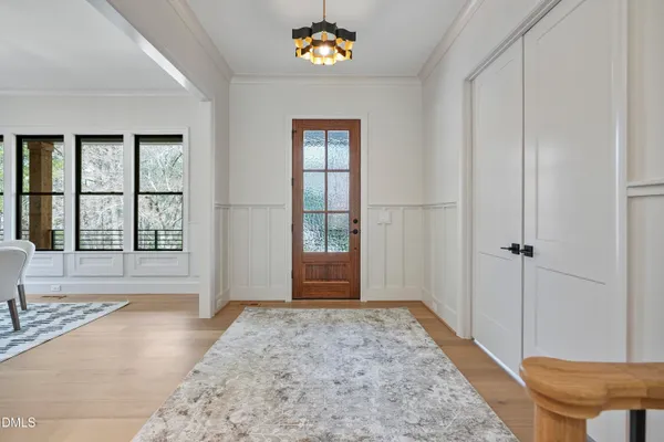 a bathroom with a granite countertop sink a mirror a vanity and a shower