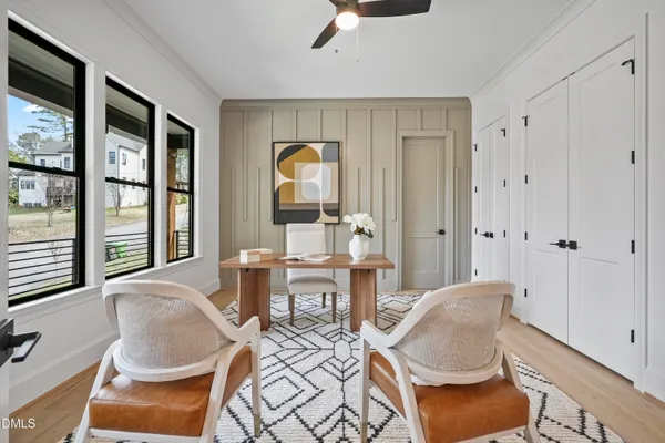 a view of a room with wooden floor chandelier and chandelier