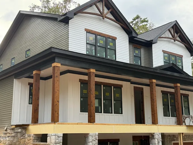 a front view of a house with parking space