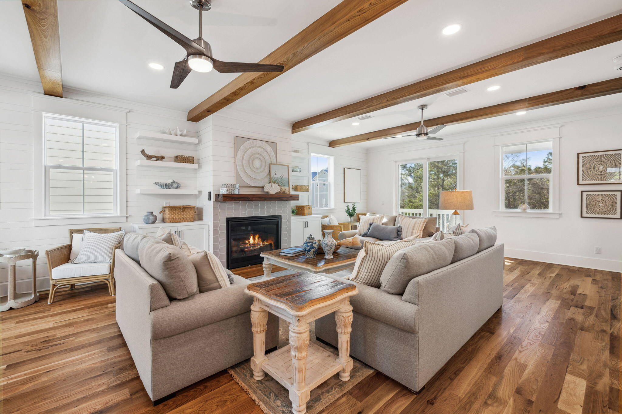 200 Grayton Boulevard Santa Rosa Beach, FL 32459 - Photo 2 of 50 a living room with furniture a large window and a fireplace