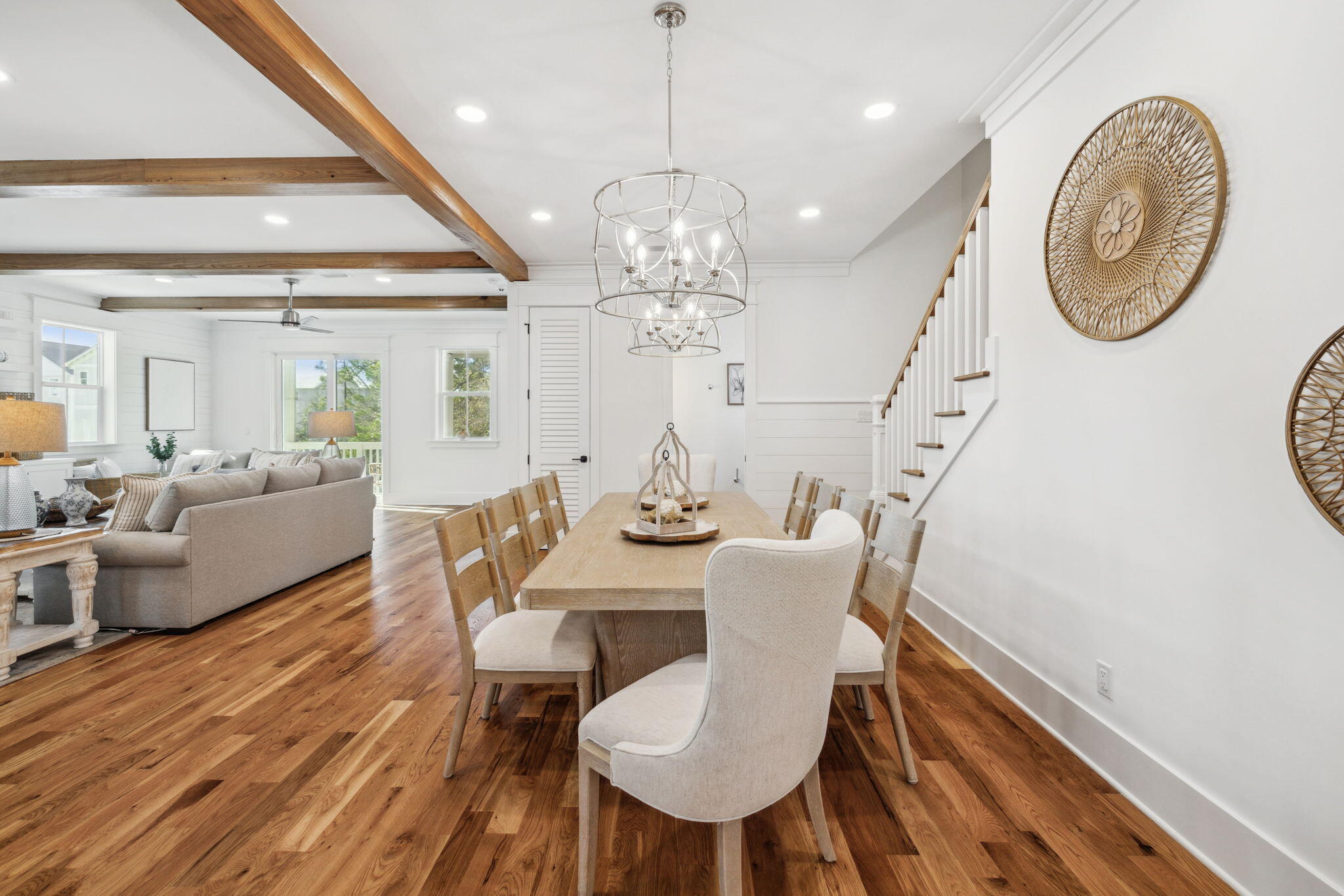 200 Grayton Boulevard Santa Rosa Beach, FL 32459 - Photo 22 of 50 a view of a dining room with furniture a chandelier and wooden floor