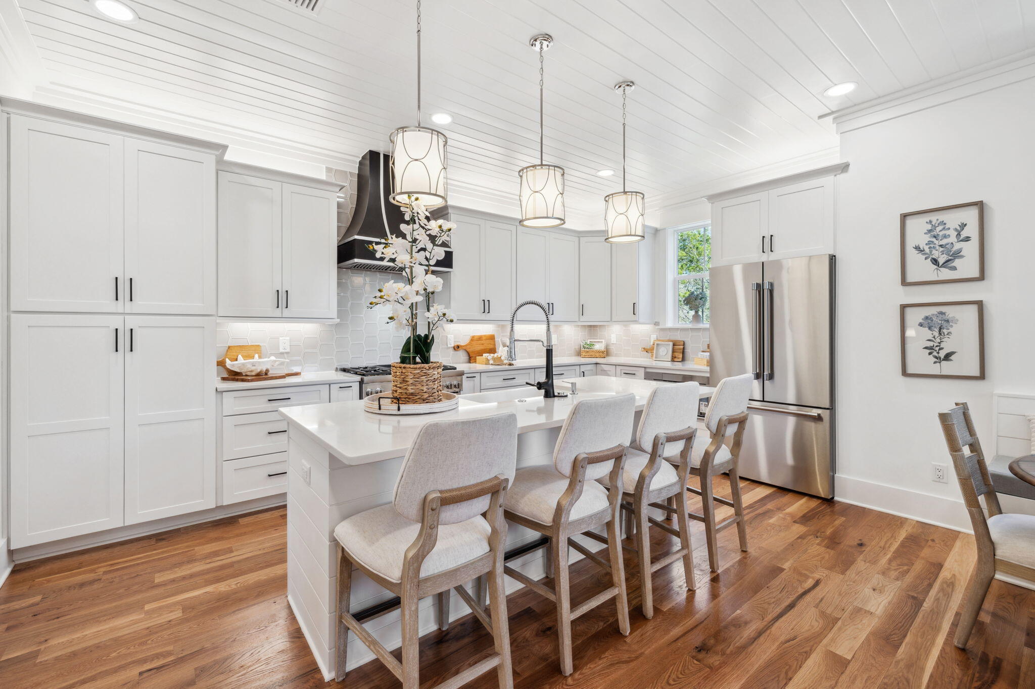 200 Grayton Boulevard Santa Rosa Beach, FL 32459 - Photo 3 of 50 a kitchen with a dining table chairs sink and stove