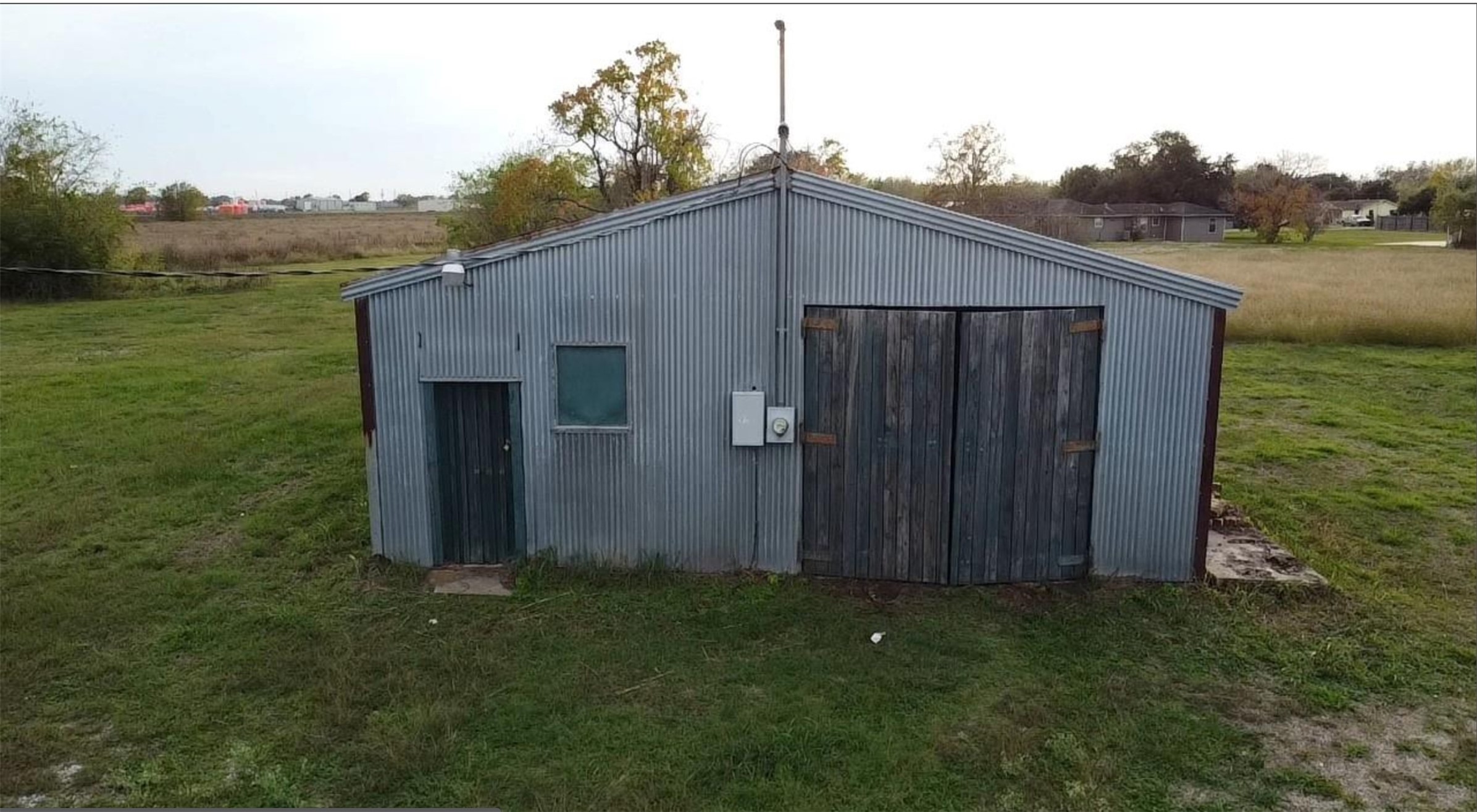 a backyard of a house with lots of green space