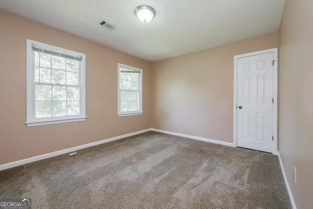 a bathroom with a sink toilet and a mirror