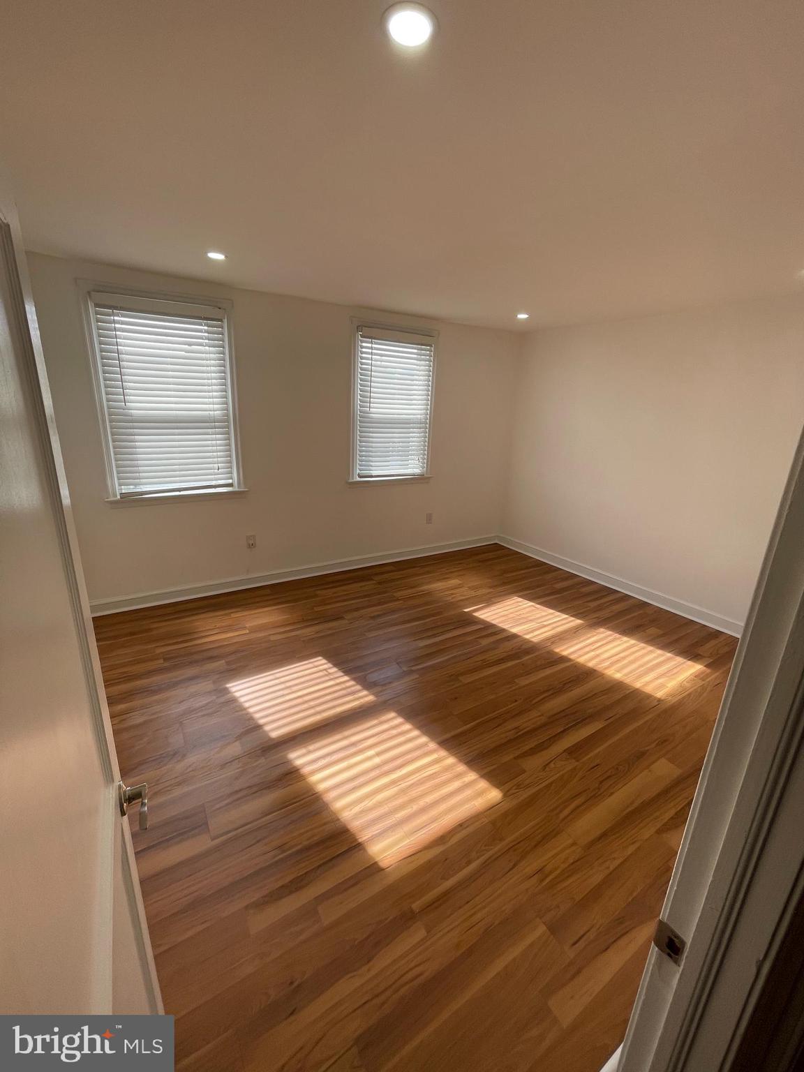 1353 Fanshawe Street Philadelphia, PA 19111 - Photo 13 of 41 an empty room with wooden floor and windows