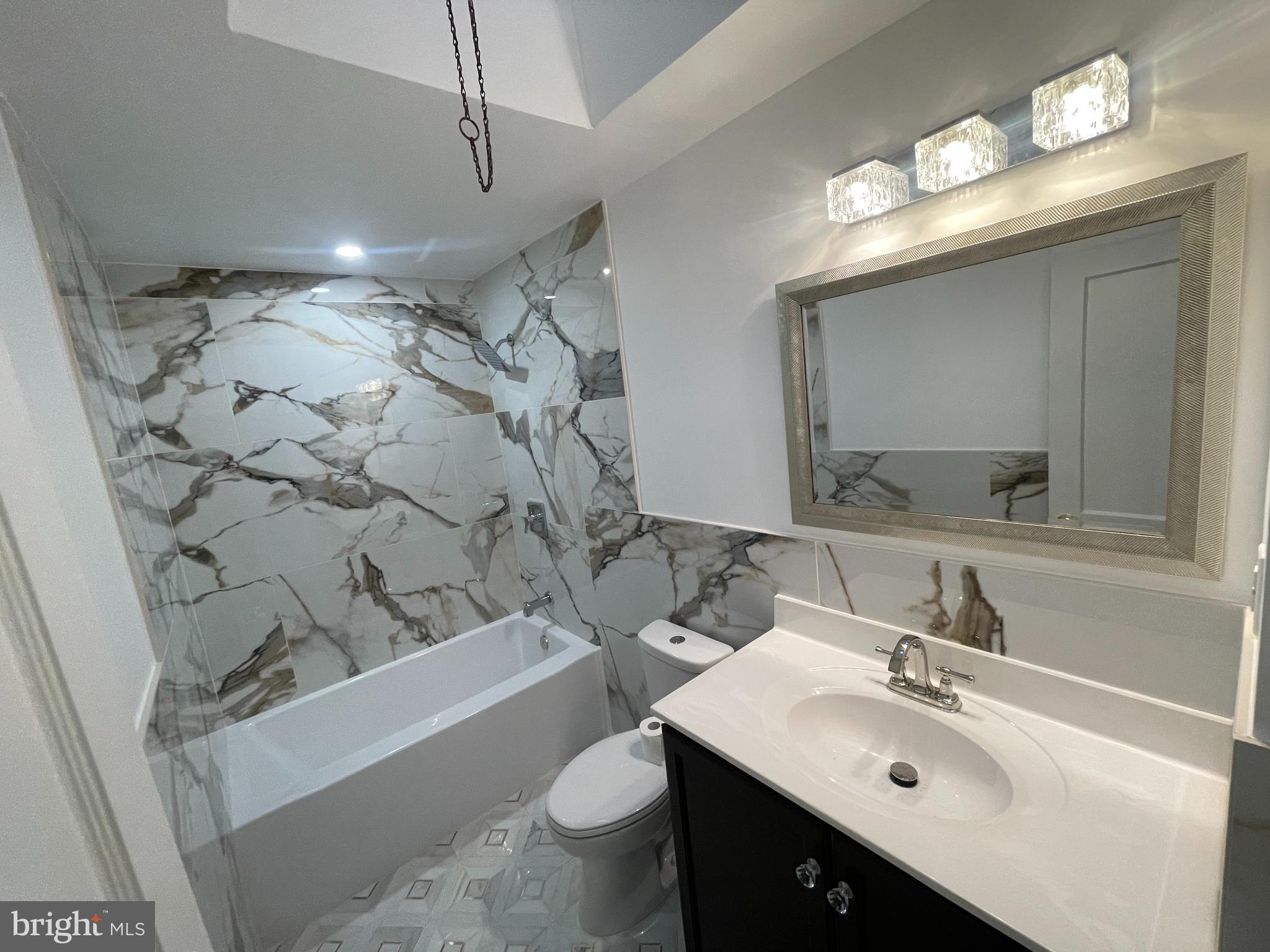 1353 Fanshawe Street Philadelphia, PA 19111 - Photo 16 of 41 a bathroom with a sink vanity mirror and toilet