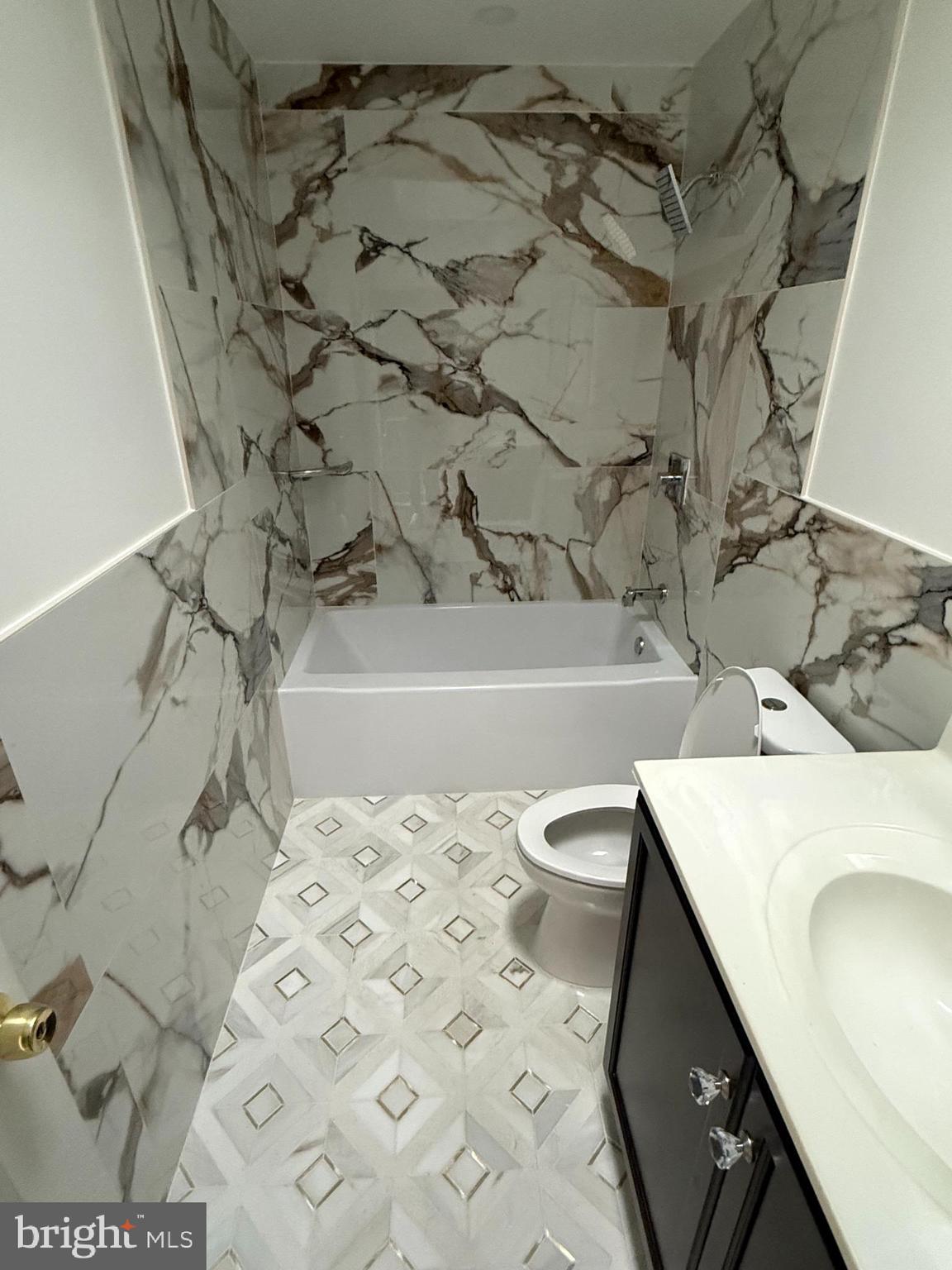 1353 Fanshawe Street Philadelphia, PA 19111 - Photo 19 of 41 a bathroom with a sink a toilet and shower