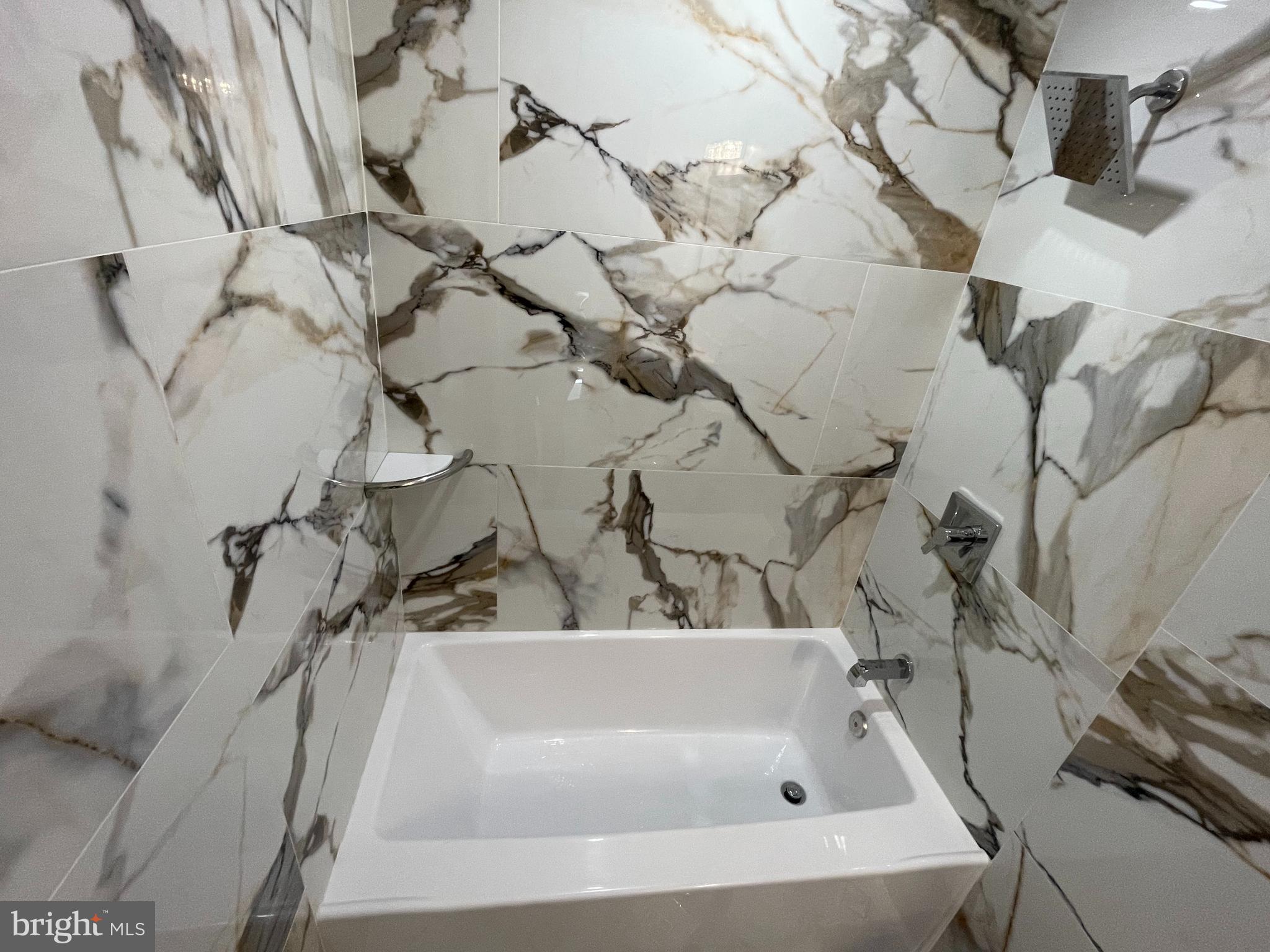 1353 Fanshawe Street Philadelphia, PA 19111 - Photo 20 of 41 a bathroom with a bathtub and shower