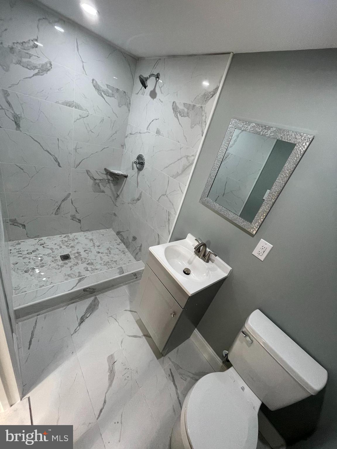 1353 Fanshawe Street Philadelphia, PA 19111 - Photo 25 of 41 a bathroom with a sink toilet and mirror