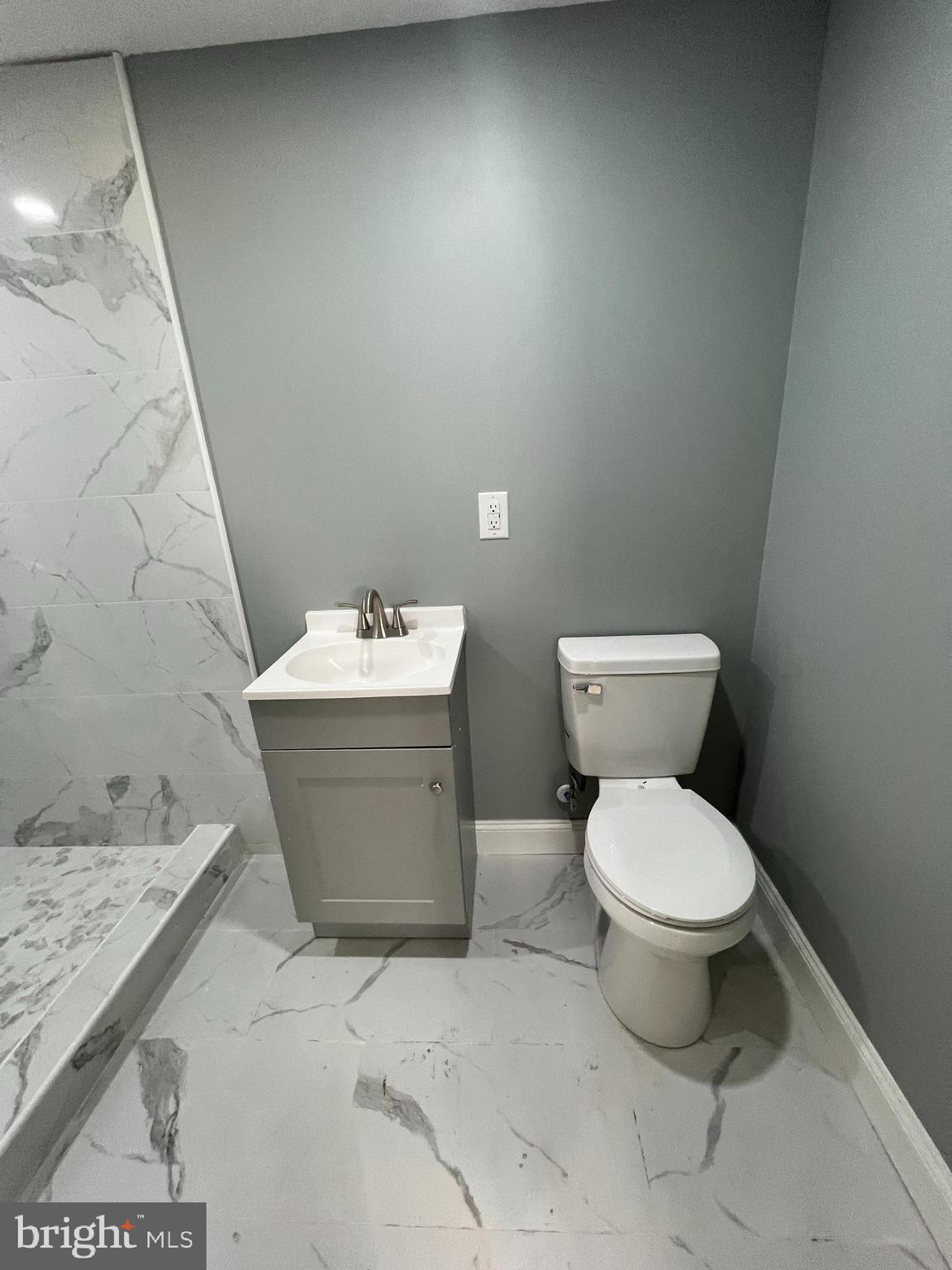 1353 Fanshawe Street Philadelphia, PA 19111 - Photo 27 of 41 a bathroom with a sink toilet and mirror