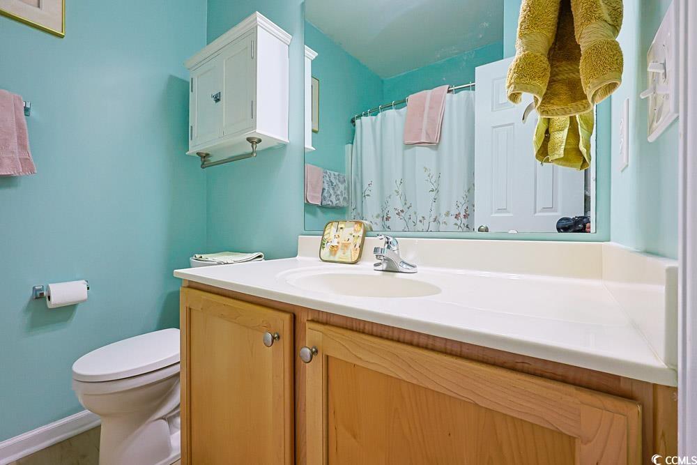 75 Field Planters Circle, Unit 75 Calabash, NC 28467 - Photo 26 of 40 Bathroom with a shower with shower curtain and vanity
