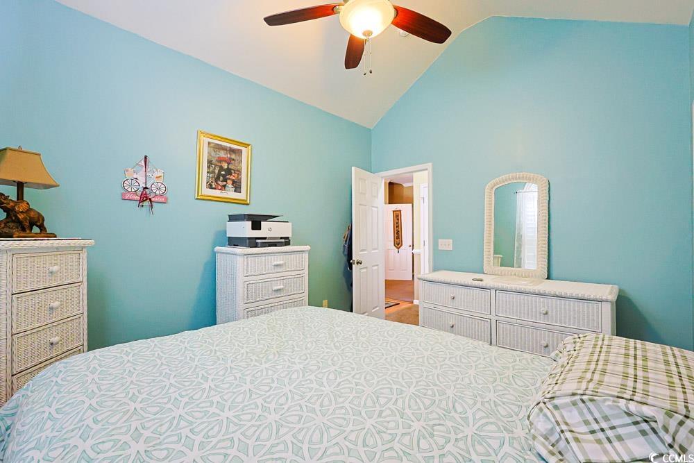 75 Field Planters Circle, Unit 75 Calabash, NC 28467 - Photo 29 of 40 Bedroom with ceiling fan and high vaulted ceiling