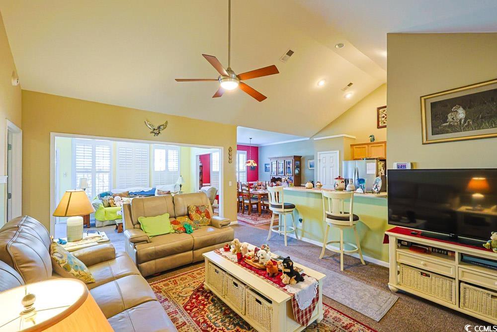 75 Field Planters Circle, Unit 75 Calabash, NC 28467 - Photo 3 of 40 Living room with ceiling fan, high vaulted ceiling, and carpet flooring