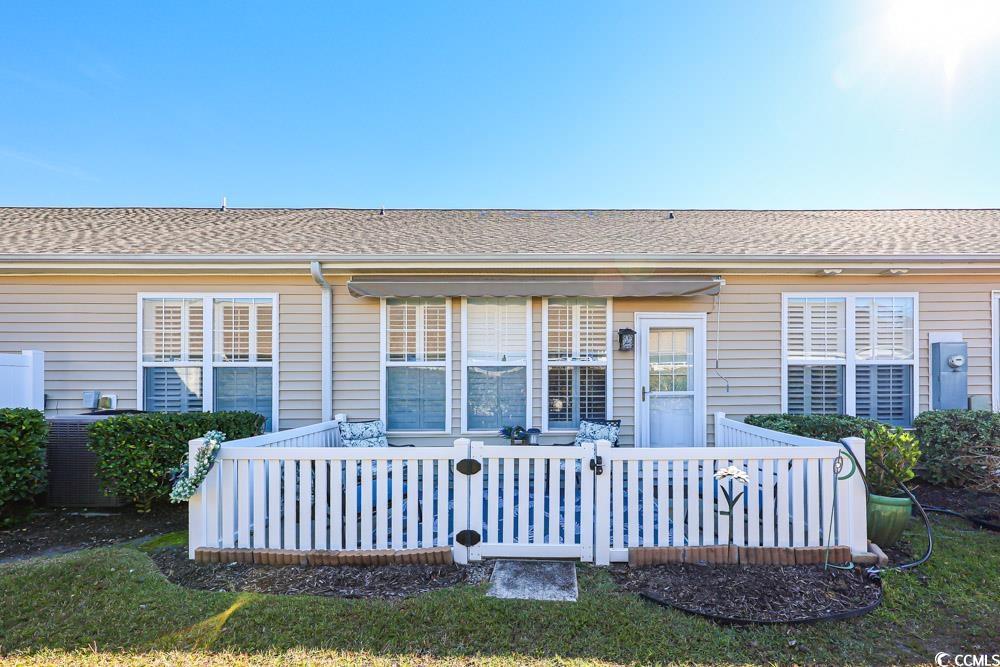 75 Field Planters Circle, Unit 75 Calabash, NC 28467 - Photo 32 of 40 Back of property featuring a shingled roof and a patio