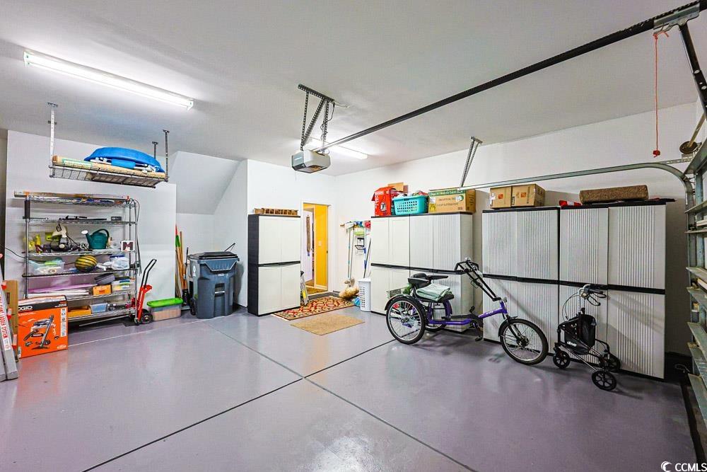 75 Field Planters Circle, Unit 75 Calabash, NC 28467 - Photo 37 of 40 Garage with freestanding refrigerator