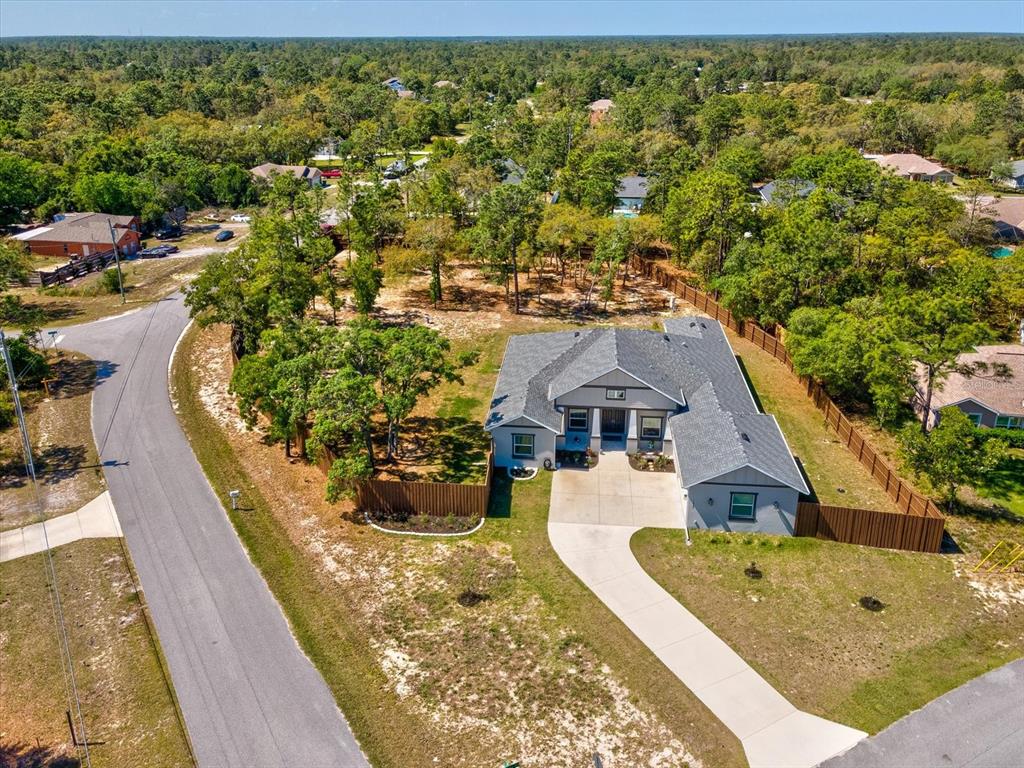 11981 Robina Road Weeki Wachee, FL 34614 - Photo 64 of 93 an aerial view of a house with swimming pool