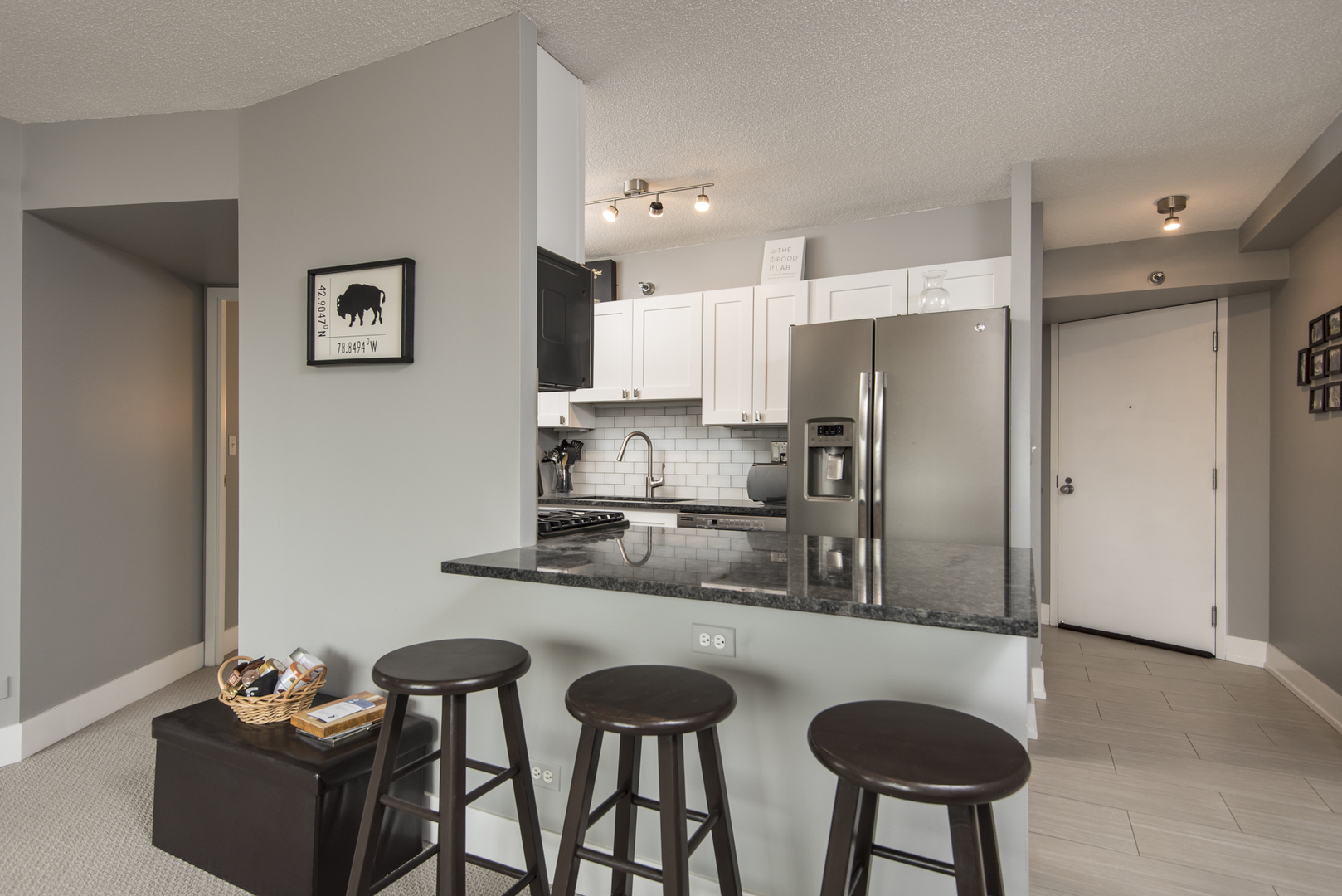 Undisclosed Address Chicago, IL 60610 - Photo 11 of 24 a kitchen with stainless steel appliances granite countertop a refrigerator and a stove top oven