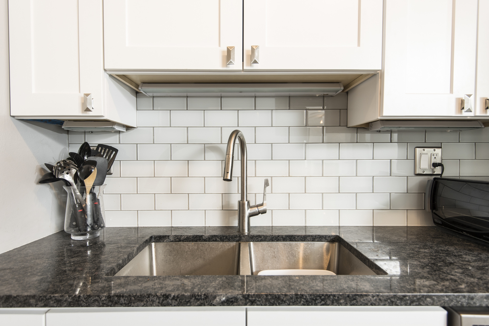 Undisclosed Address Chicago, IL 60610 - Photo 13 of 24 a kitchen with a sink and cabinets