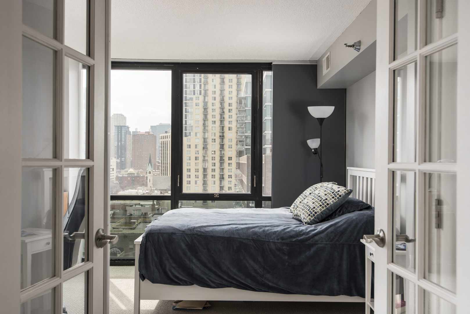 Undisclosed Address Chicago, IL 60610 - Photo 14 of 24 a bedroom with a bed and a window