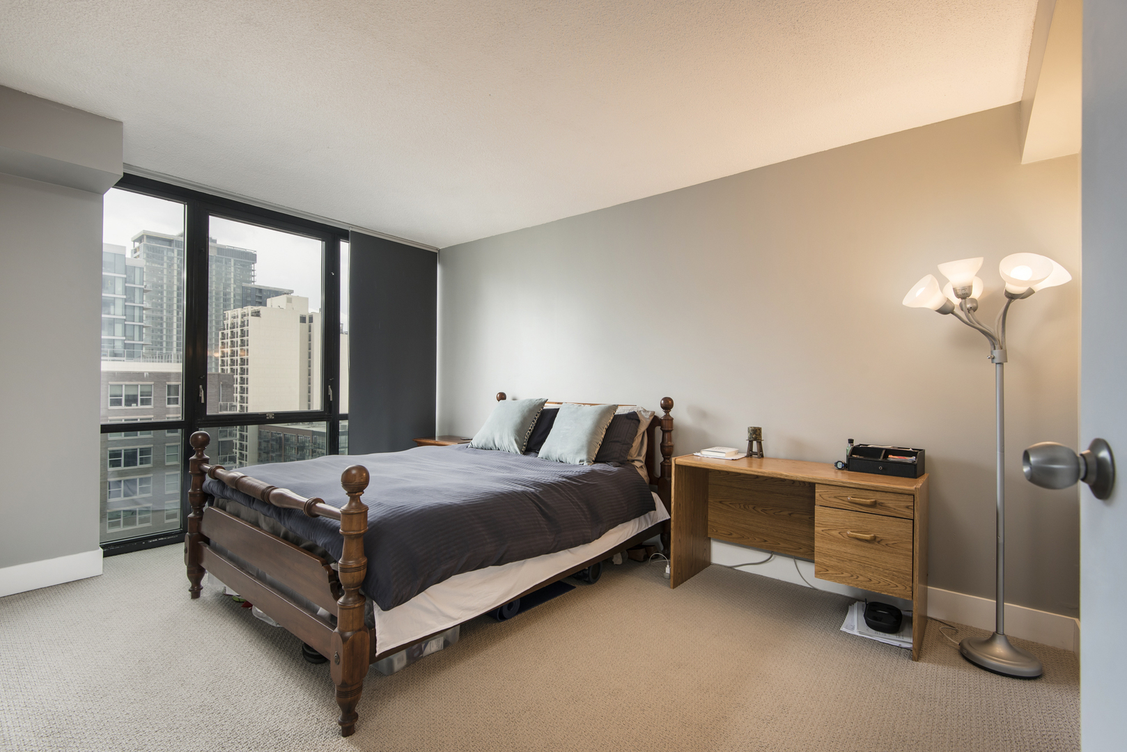 Undisclosed Address Chicago, IL 60610 - Photo 17 of 24 a bed sitting in a bedroom next to a window