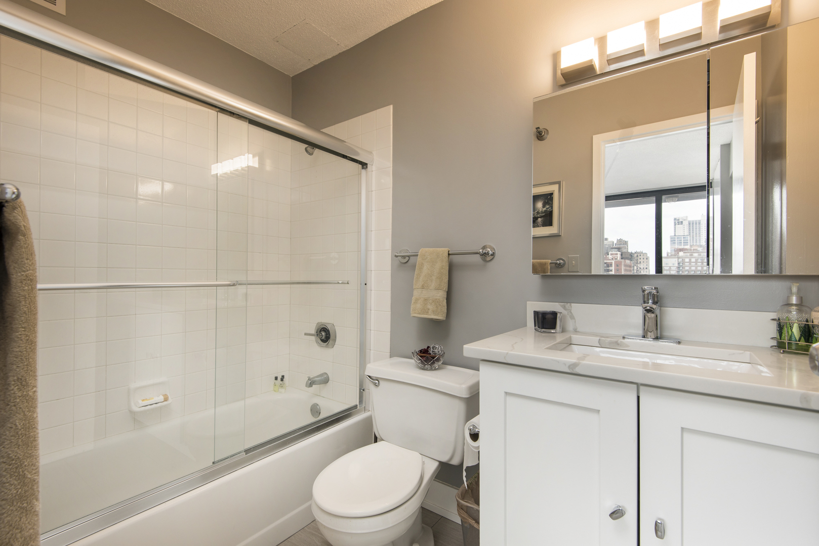 Undisclosed Address Chicago, IL 60610 - Photo 18 of 24 a bathroom with a sink a toilet and shower