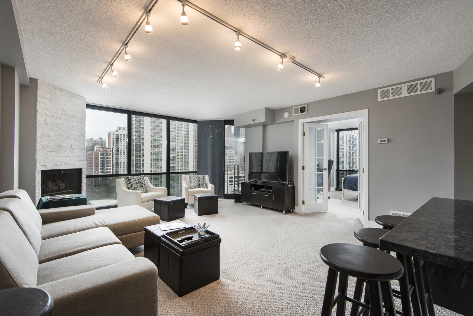 Undisclosed Address Chicago, IL 60610 - Photo 4 of 24 a living room with furniture a fireplace and a flat screen tv