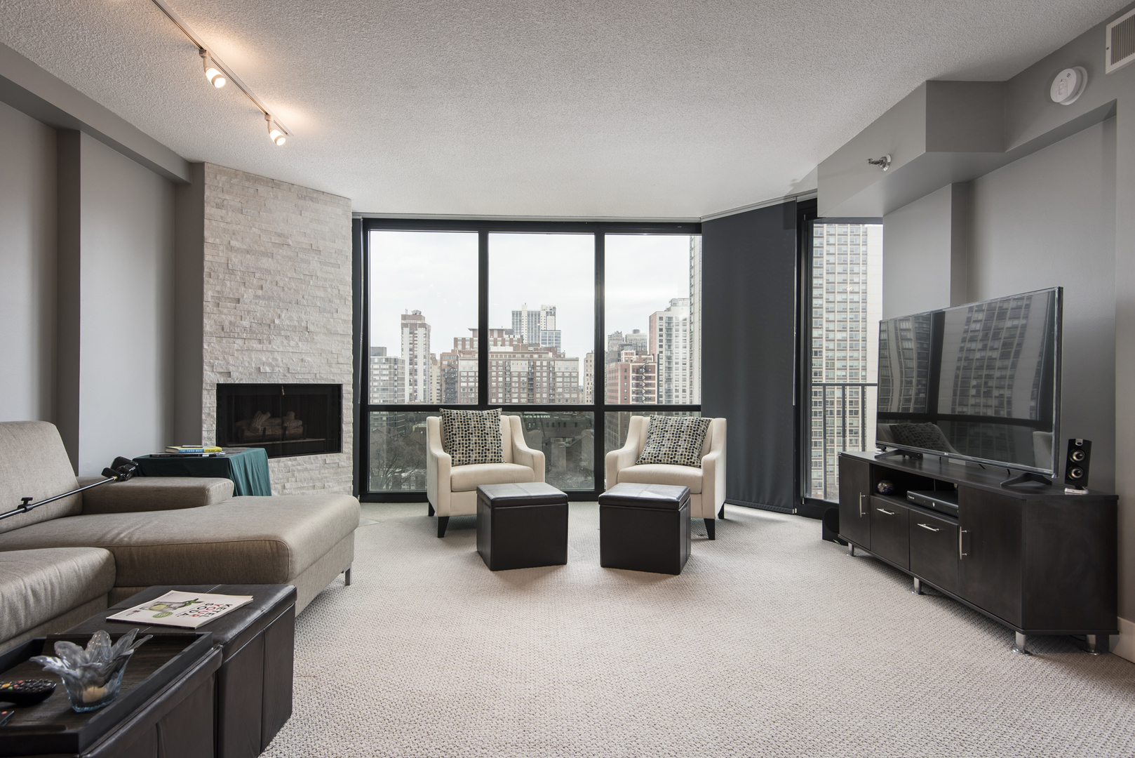 Undisclosed Address Chicago, IL 60610 - Photo 6 of 24 a living room with fireplace furniture and a flat screen tv