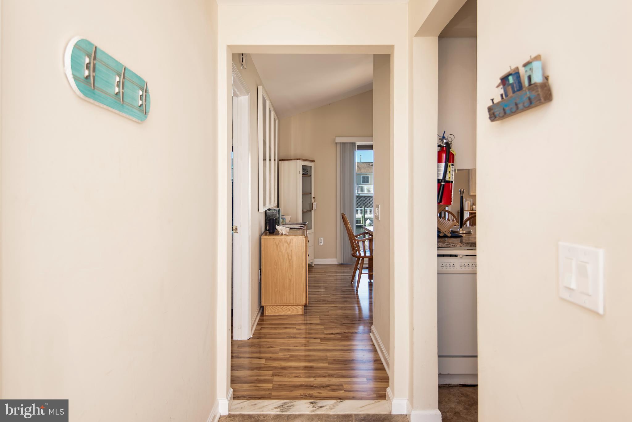 28 Diane Road Manahawkin, NJ 08050 - Photo 18 of 46 a view of a hallway with wooden floor and closet