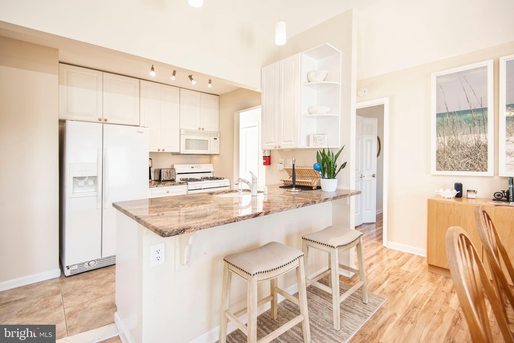 28 Diane Road Manahawkin, NJ 08050 - Photo 23 of 46 a kitchen with stainless steel appliances granite countertop a sink and a refrigerator