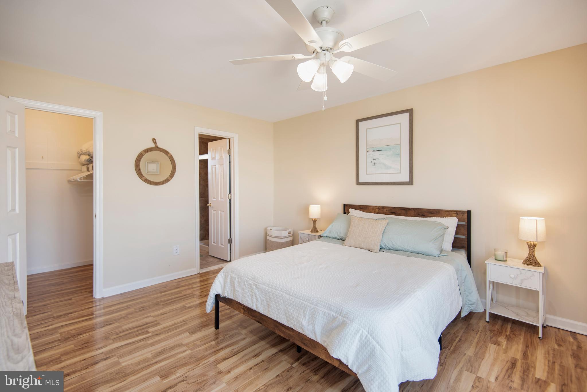 28 Diane Road Manahawkin, NJ 08050 - Photo 28 of 46 a bedroom with a bed and wooden floor