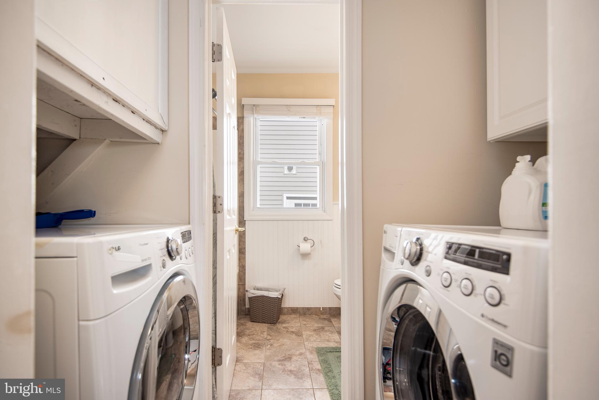 28 Diane Road Manahawkin, NJ 08050 - Photo 31 of 46 a view of washer and dryer in a utility room
