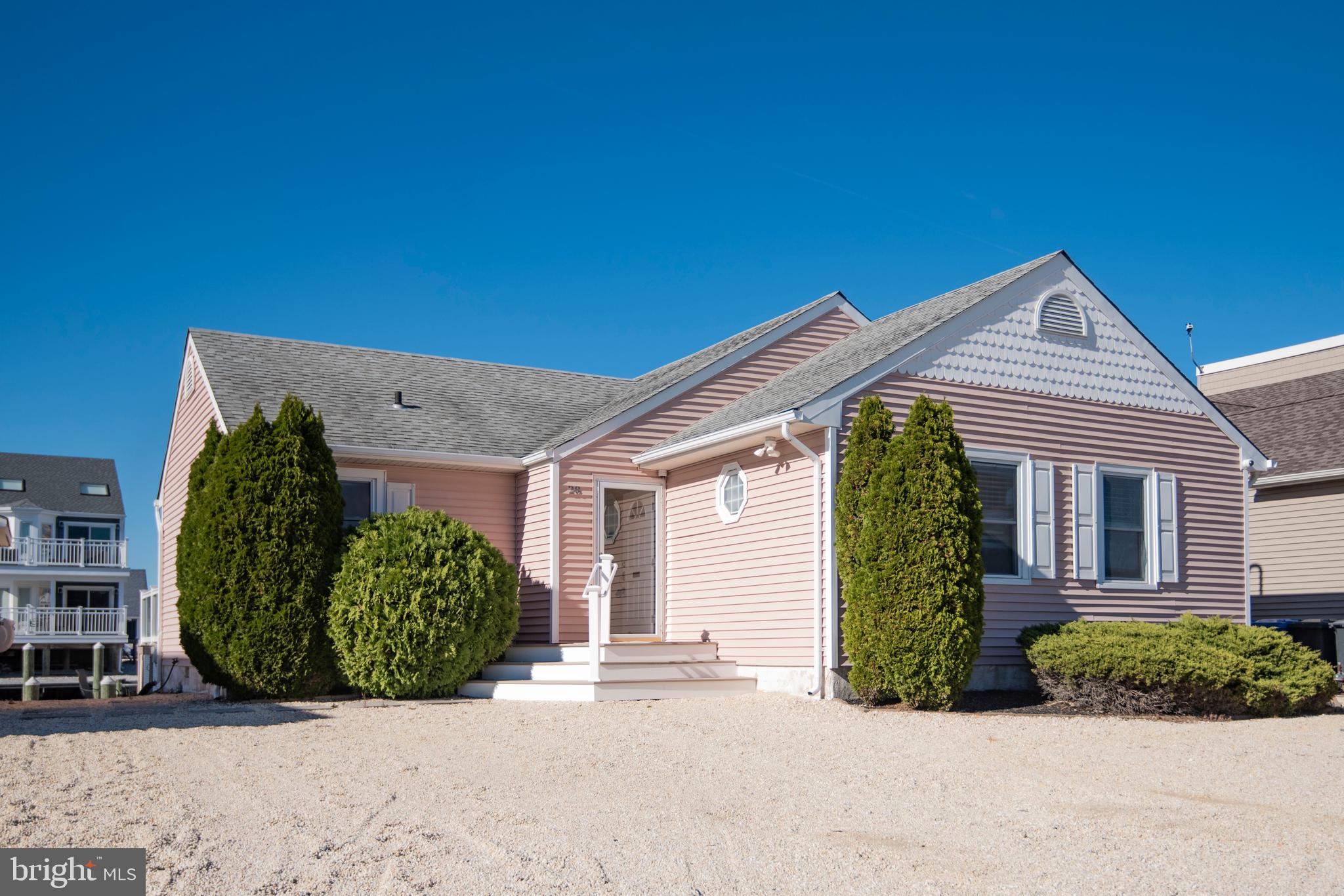 28 Diane Road Manahawkin, NJ 08050 - Photo 38 of 46 a view of a house with potted plants